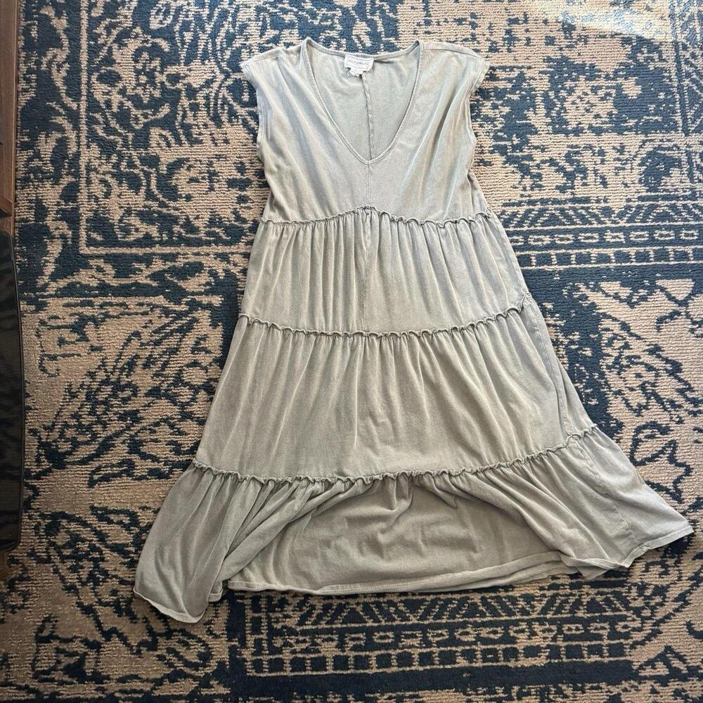 The For The Republic Sage Green Tiered Midi Dress is a stylish and elegant optio